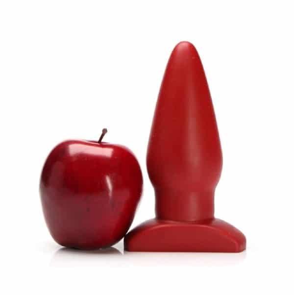 Tantus Ringo thick butt plug next to an apple for size comparison