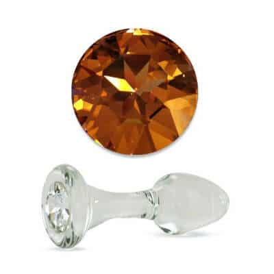 Clear glass butt plug with long stem and short bulb, yellow crystal base