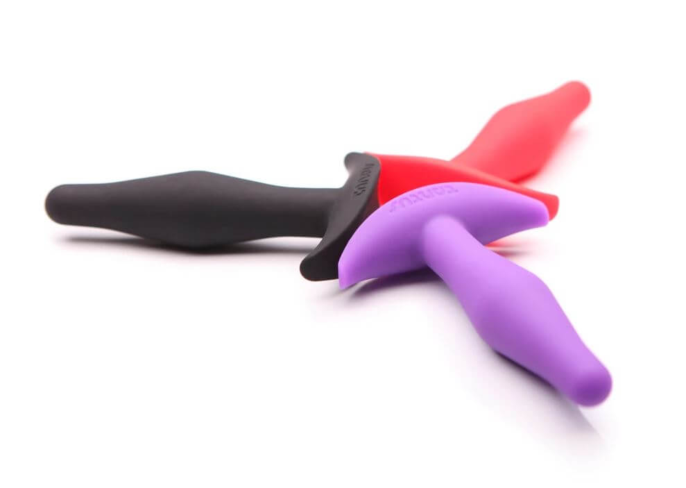Tantus Little Flirt beginner butt plugs in pink, purple, and black.